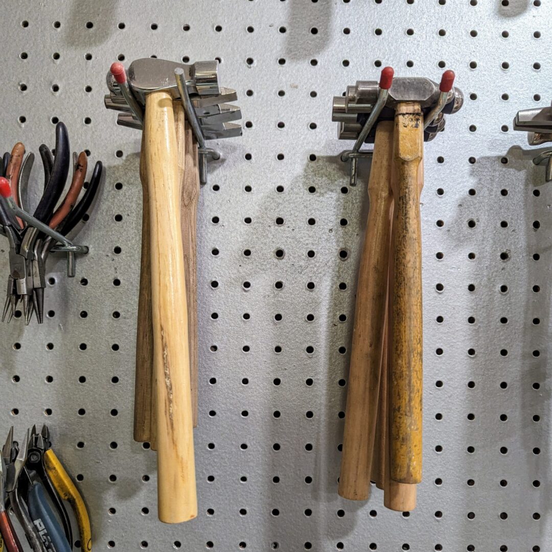 image of ball pin hammers hanging on a peg board