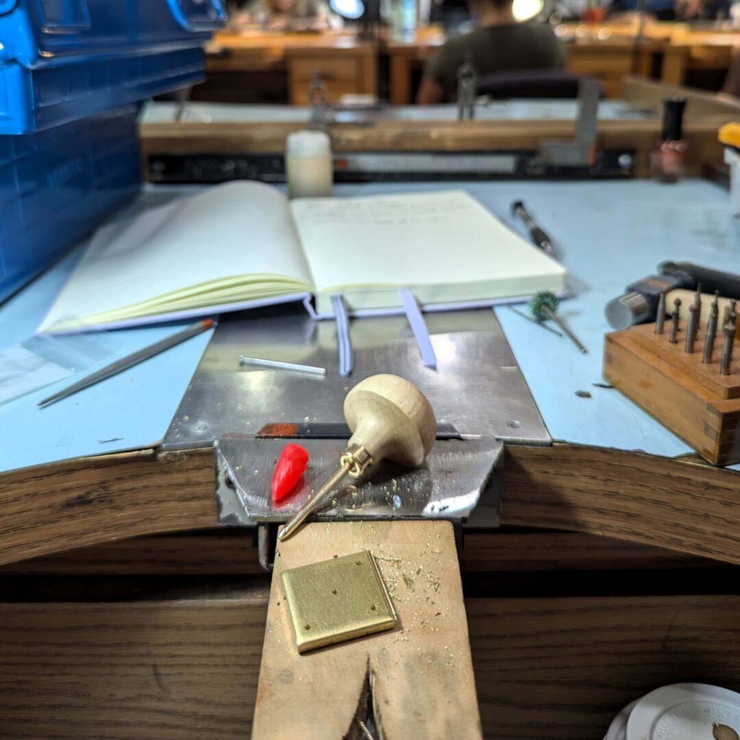 various jewelry making tools on the bench