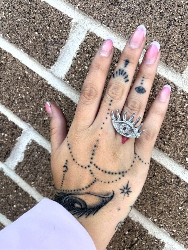 a ring in a shape of an eye with eyelashes thar was cast using lost wax method