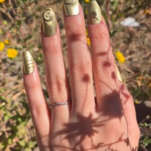 custom set of metal nails in brass