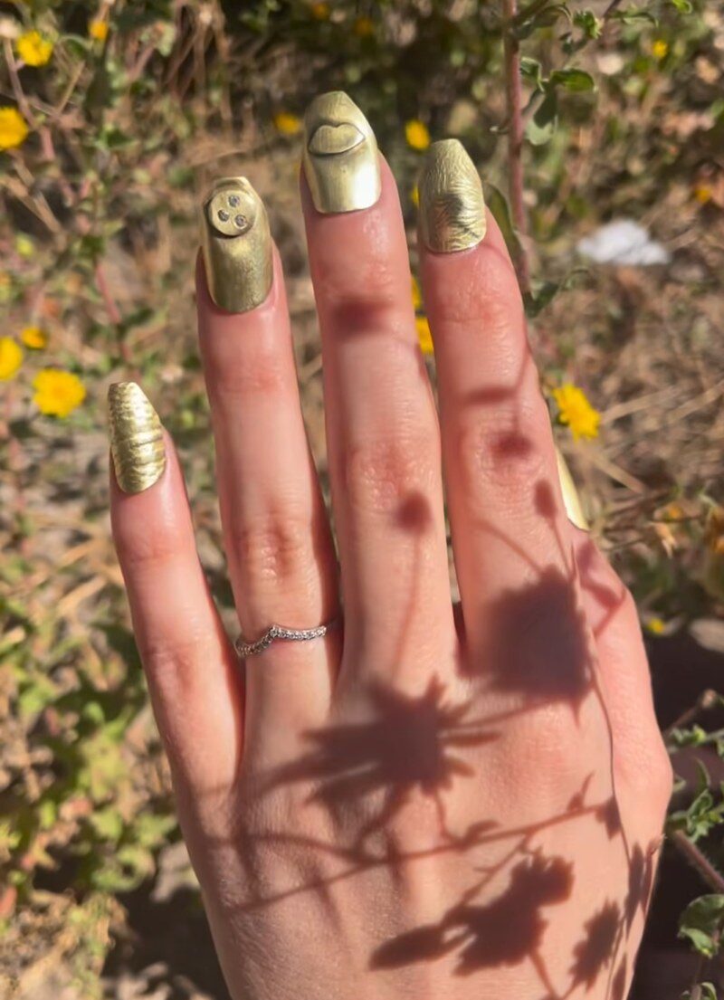 custom set of metal nails in brass