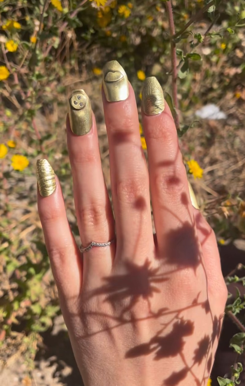 custom set of metal nails in brass