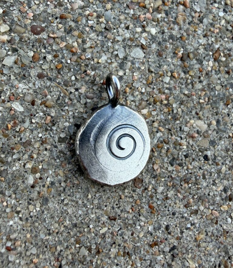 charm in silver with spiral stamp and patina