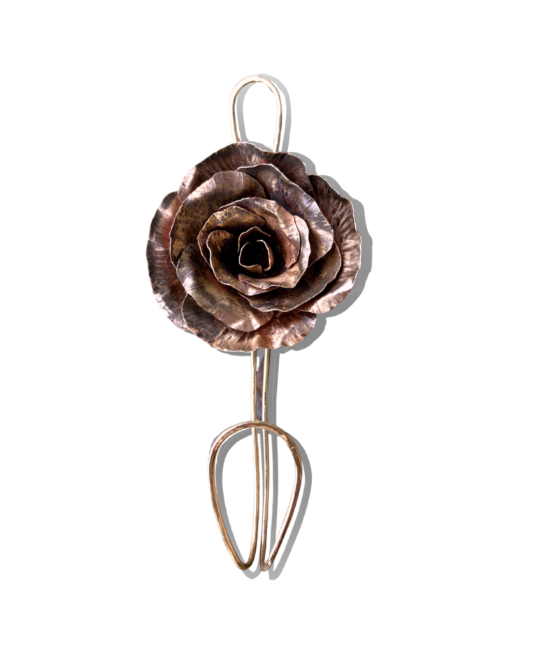 Handmade copper rose with layered metal petals, created in a Forming flowers jewelry class at The Jeweler’s Saw in Austin.